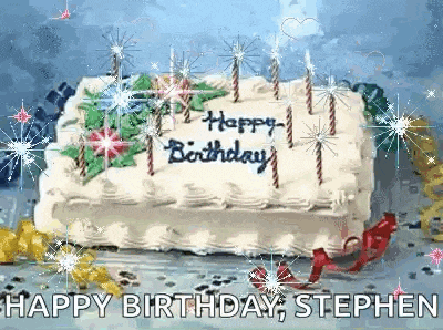 a birthday cake with candles and the words happy birthday written on it