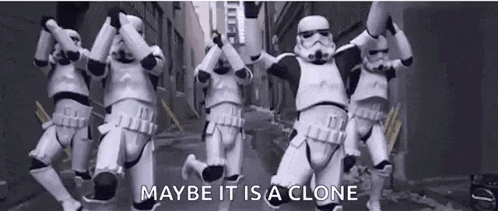 a group of stormtroopers are running down a street in a video .