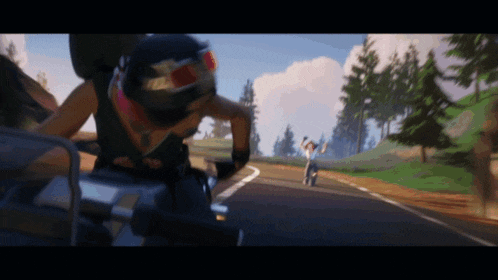 a person on a motorcycle wearing a helmet that says ' tc ' on it