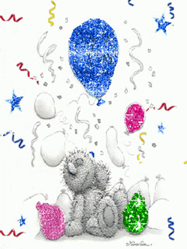 a teddy bear is sitting under a blue balloon