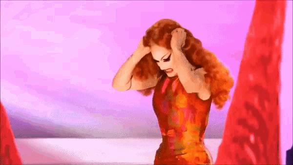 a woman in a red dress is holding her head