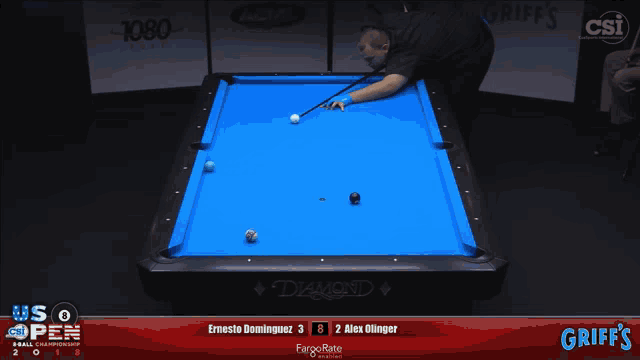 a pool table with a blue cloth and the word diamond on it