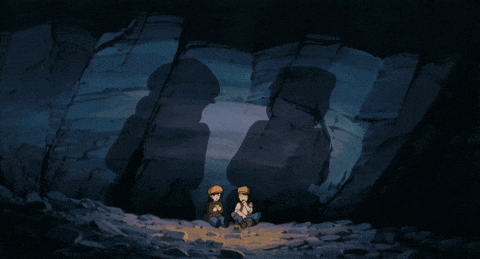 two boys sit in a cave with a shadow of a man on the wall