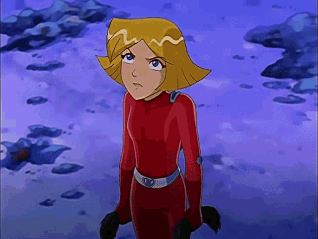 a cartoon character in a red suit is standing on a purple background .