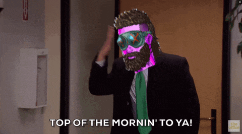 a man in a suit and tie says top of the mornin to ya