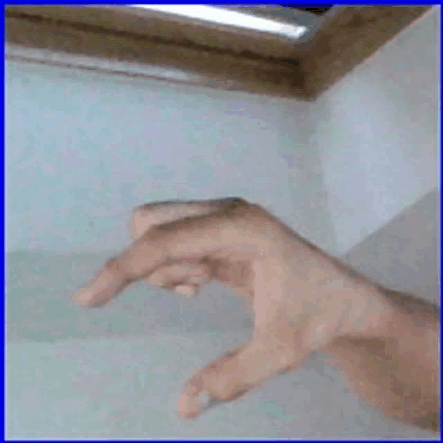 a close up of a person 's hand with their fingers crossed
