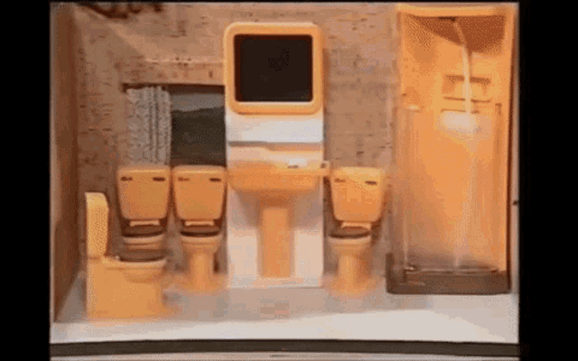 a bathroom with two toilets , a sink , and a shower stall .