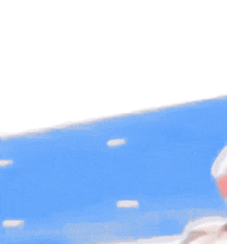a person riding a red motorcycle in front of a blue wall