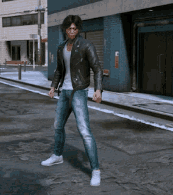 a man in a leather jacket and jeans is standing on a city street
