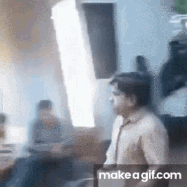 a blurry picture of a man standing in front of a mirror .