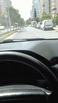 a car is driving down a street with a speed limit of 40