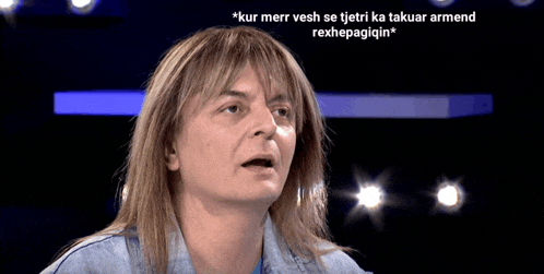 a woman with long blonde hair and a caption that says * kur merr vesh se tjeti ka takuar armend rexhepaigiin