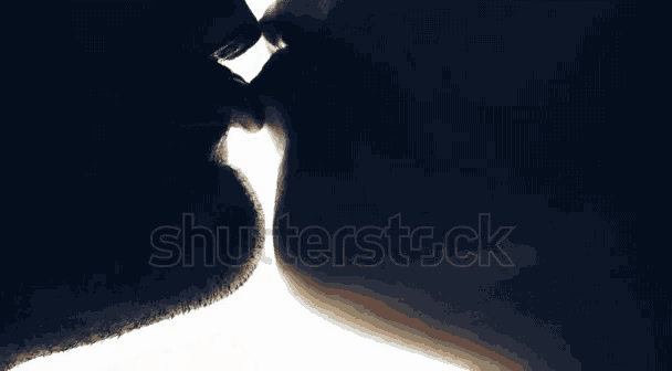 a silhouette of a man and woman kissing with the words shutterstock visible in the corner