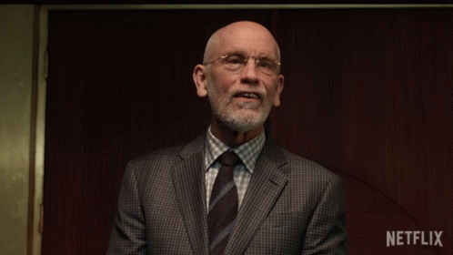 Cover Mouth Dr Adrian Mallory GIF - Cover Mouth Dr Adrian Mallory John Malkovich GIFs