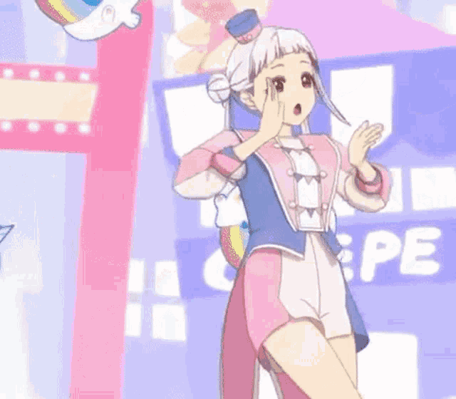 a girl in a pink and blue outfit is holding a stuffed cat in her hand .