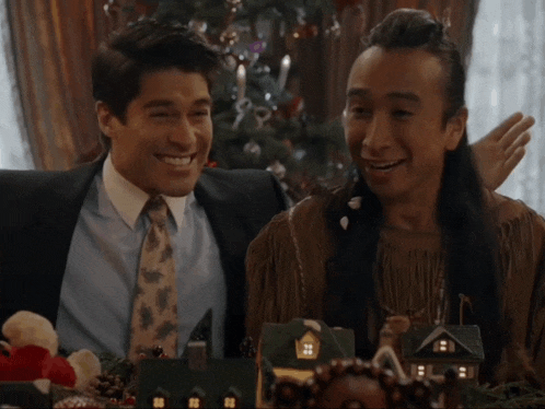 two men are sitting next to each other and one of them says " this guy is mentally ill but i love him ! "