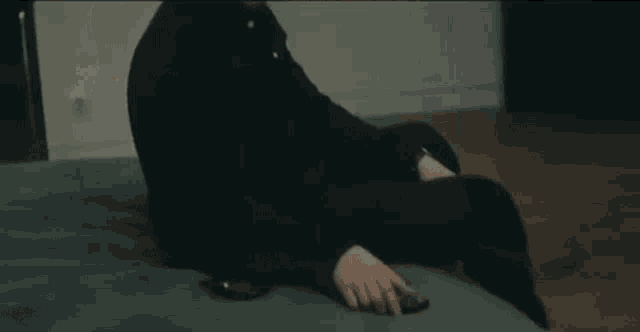 a man is taking a picture of himself with a cell phone .