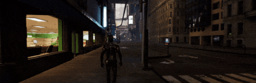 a man is walking down a street in front of a building that has a sign that says ' nbc ' on it