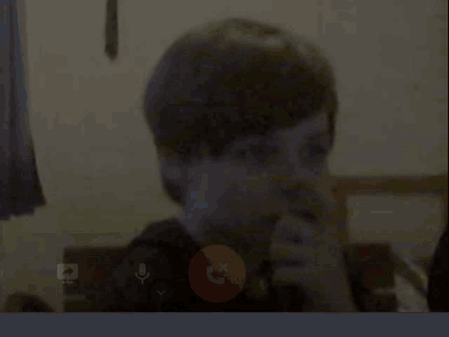 a person is talking on a video call with a red circle with a x in it