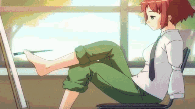 a girl with red hair is sitting in front of an easel painting her feet