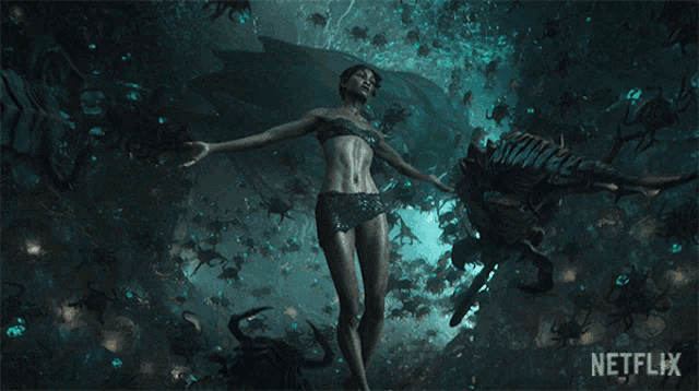 a woman in a bikini is surrounded by crabs with a netflix logo in the background