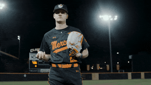 a baseball player wearing a black merc jersey