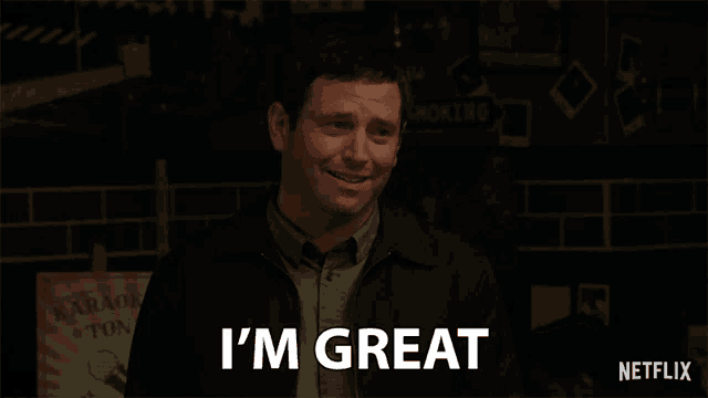 a man says i 'm great in front of a netflix sign
