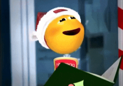 a smiley face wearing a santa hat is singing a christmas carol