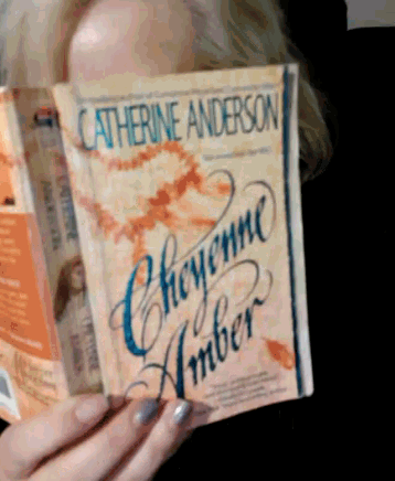 a woman is reading a book by catherine anderson called cheyenne amber
