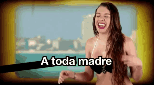 a woman in a bikini is laughing with the words a toda madre above her