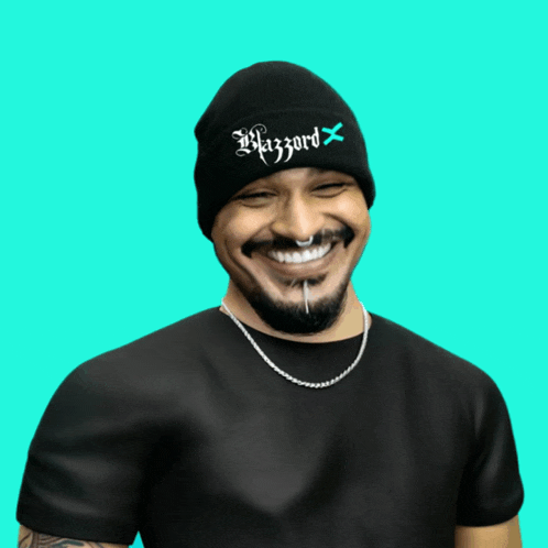 a man wearing a beanie that says hazzard x on it
