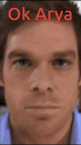 a close up of a man 's face with the words ok arya written above it