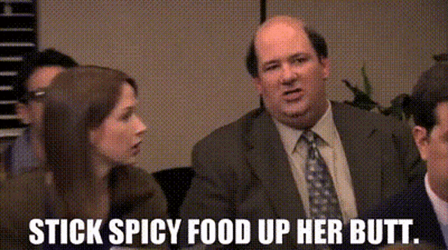 a man in a suit and tie is sitting at a table with a woman .