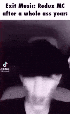 a man wearing a hat and a mask is talking about exit music .
