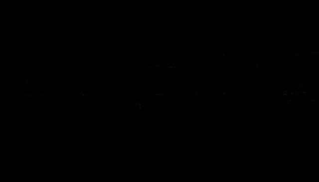 a man kicking a soccer ball into a goal