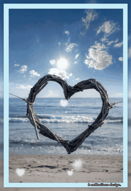 a picture of a heart shaped wreath on a beach