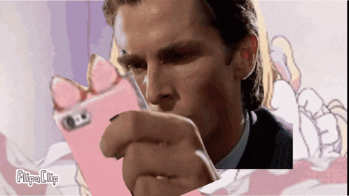 a man is holding a pink phone in his hand and the word flipa clip is on the bottom