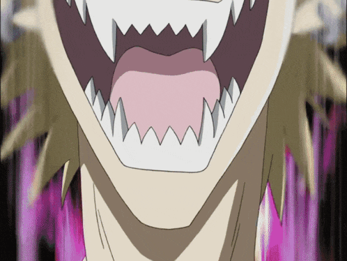 a close up of a person 's mouth with teeth showing