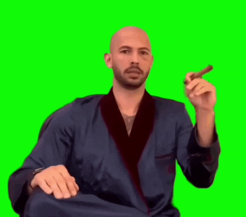 the man is wearing a robe and smoking a cigar .