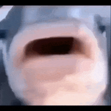 a close up of a person 's mouth with their mouth open