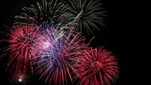 a fireworks display with the year 2023 written in white letters
