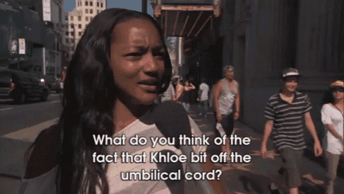 a woman is talking into a microphone with the words " what do you think of the fact that khloe bit off the umbilical cord "