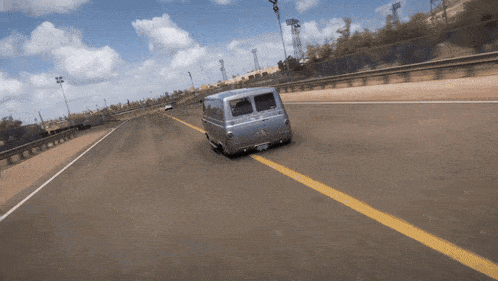 a silver van is driving down a highway with a license plate that says ' aa ' on it