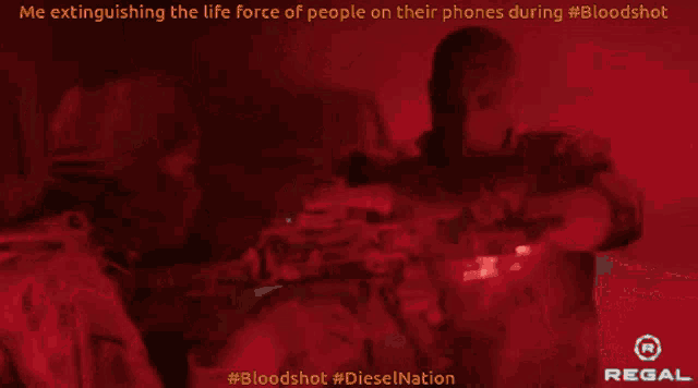 an advertisement for regal shows a man extinguishing the life force of people on their phones during a bloodshot