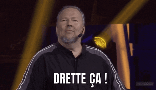 a man with a beard and a microphone says drette ca !