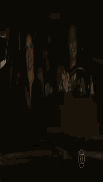 a person sitting in a dark room with a circle around their head