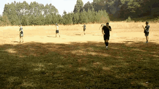 a group of people are running in a field