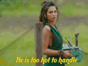 a man with long hair and a beard has the words he is too hot to handle above him