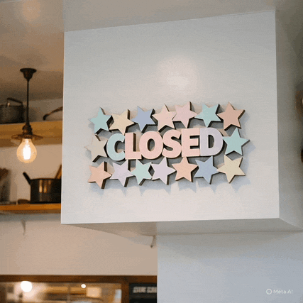 a sign on a wall that says closed with stars