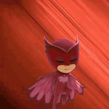 owlette from pj masks is flying in the air with a red background .